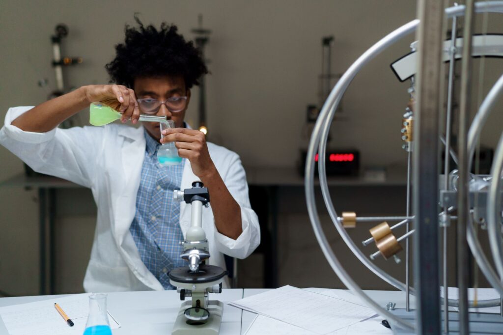 A scientist experiments with chemicals in a laboratory, making scientific discoveries.